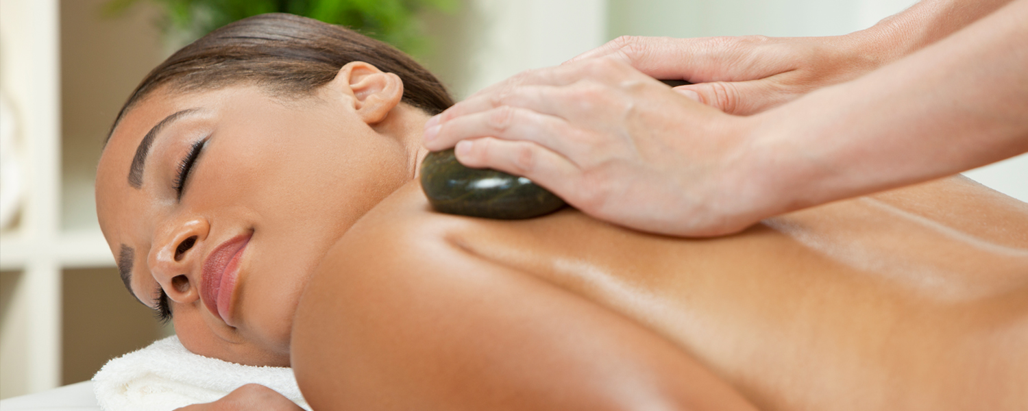 woman getting a hot stone massage