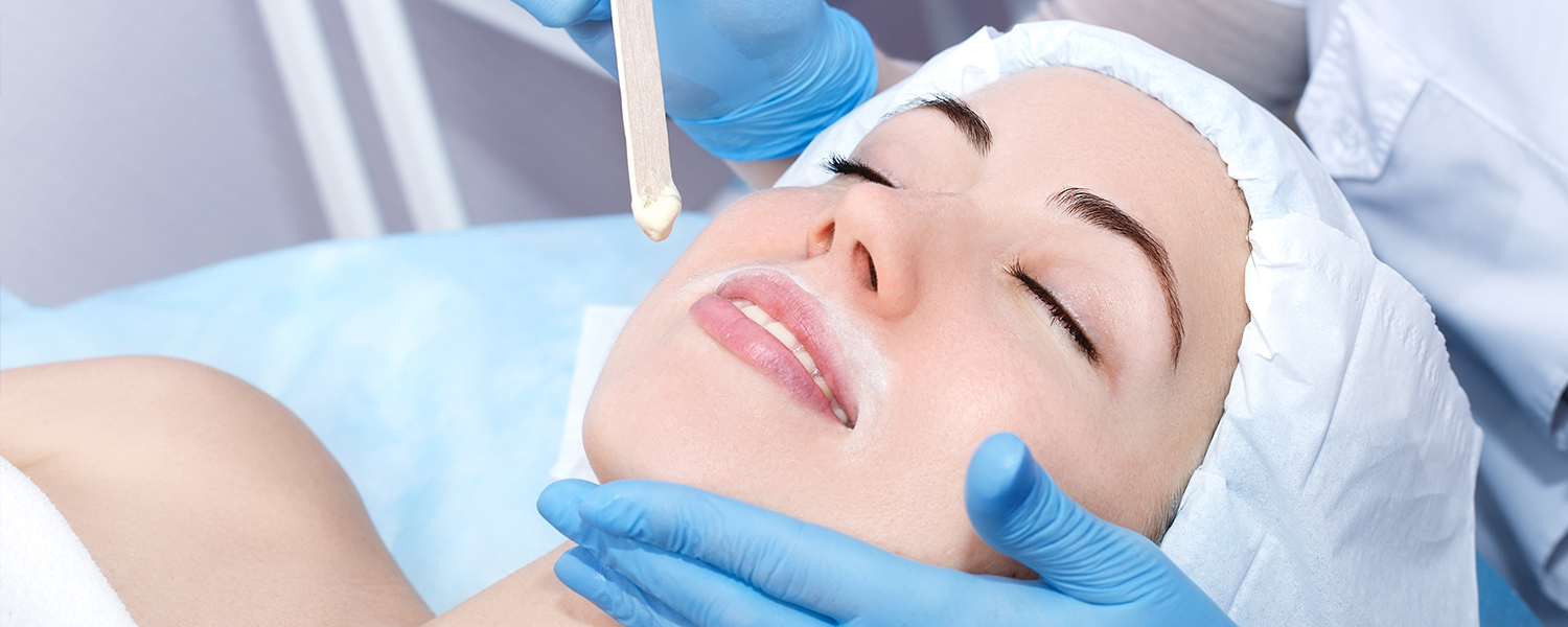 woman getting wax put on her upper lip